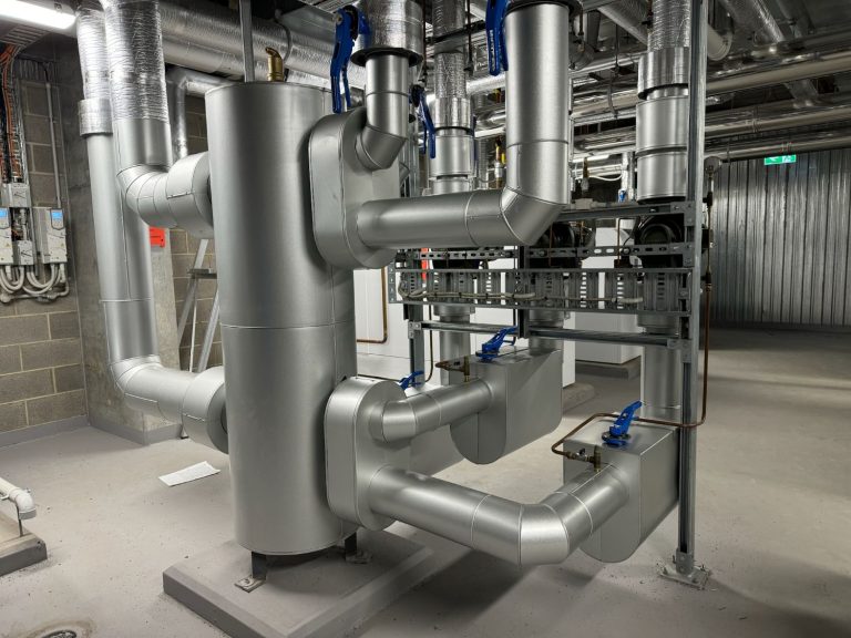 Aluminium clad chilled and heating hot water pipework in a plant room