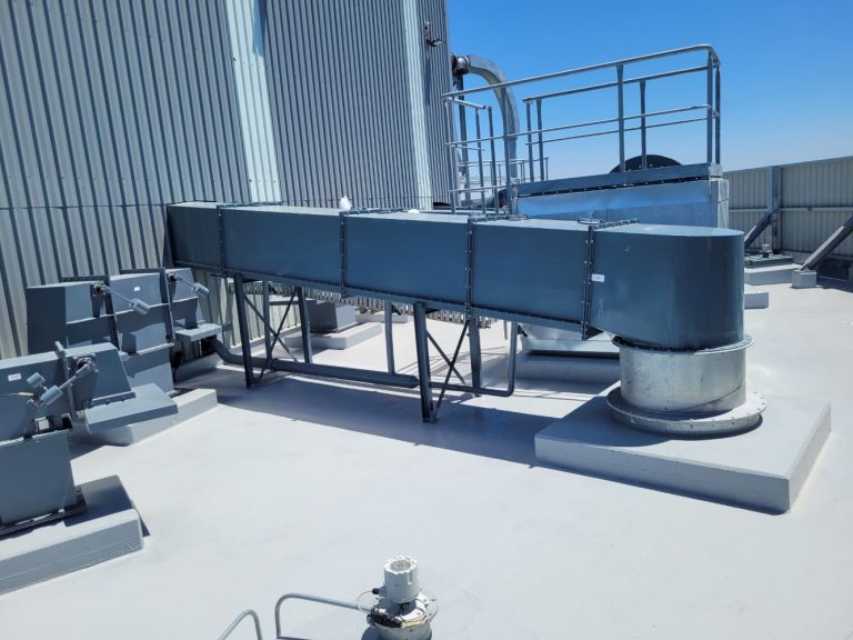 Insulated and clad external ductwork on a commercial roof